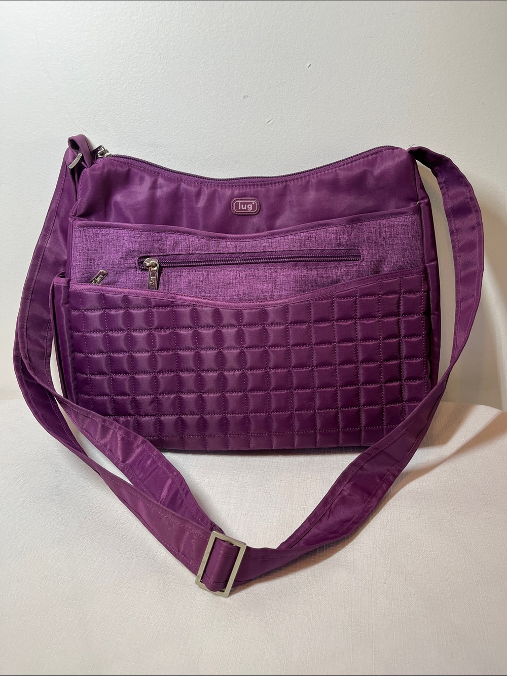 Lug Aerial Crossbody Bag featuring a quilted front pocket, zip closure